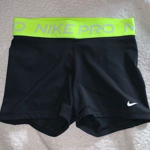 Nike pro spandex shorts in black with neon waistband
